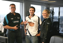 UKFast marketing director Paul Harris cutting old sponsor from Sharks shirt